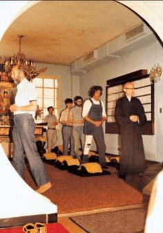 Master Sheng Yen leading Chan practitioners in walking meditation.